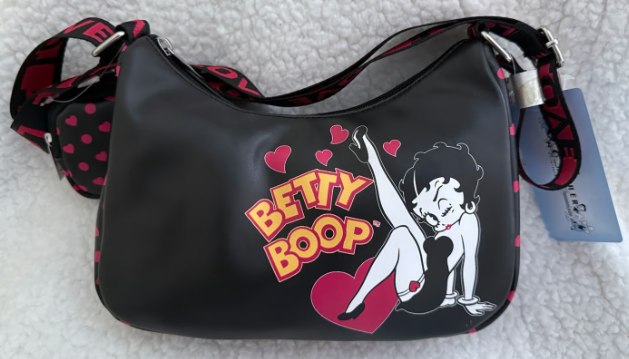Black handbag with Betty Boop design on a white surface